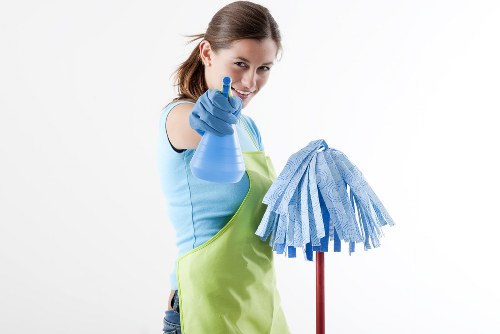 Carpet cleaning technician preparing a safe work area before starting service