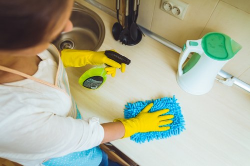 Technician preparing equipment for carpet steam cleaning in N22